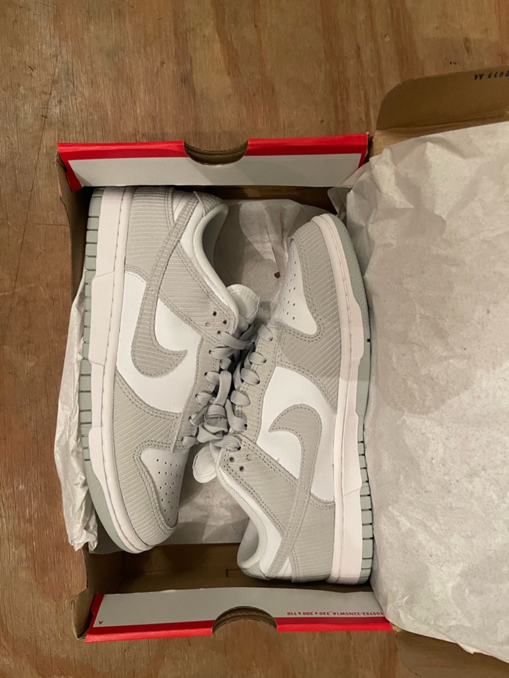 Nike women’s Low-Top Sneakers in Light Gray and White